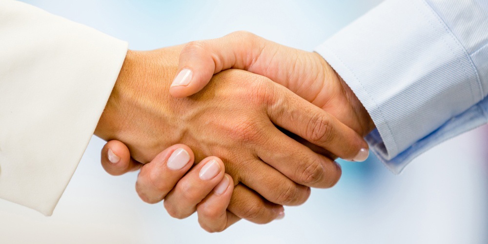 Business handshake closing a deal at the office-1.jpg Business handshake closing a deal at the office-1.jpg