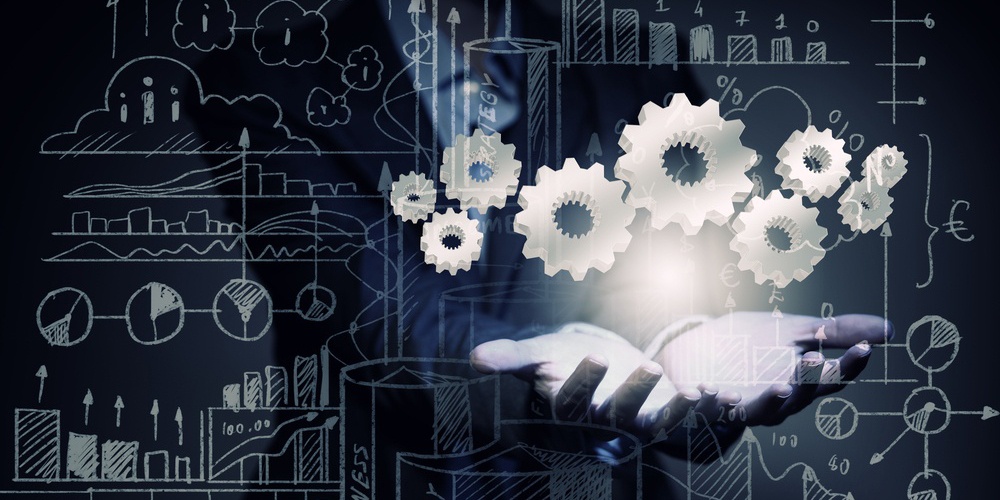 Close up of businesswoman holding gears in hand-1.jpg Close up of businesswoman holding gears in hand-1.jpg