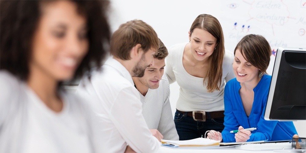 Diverse multiethnic group of young businesspeople in a meeting sitting at a table in the office discussing their business strategy and sharing information-1.jpg Diverse multiethnic group of young businesspeople in a meeting sitting at a table in the office discussing their business strategy and sharing information-1.jpg