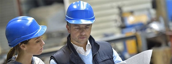 Engineers in mechanical factory reading instructions-1.jpg Engineers in mechanical factory reading instructions-1.jpg